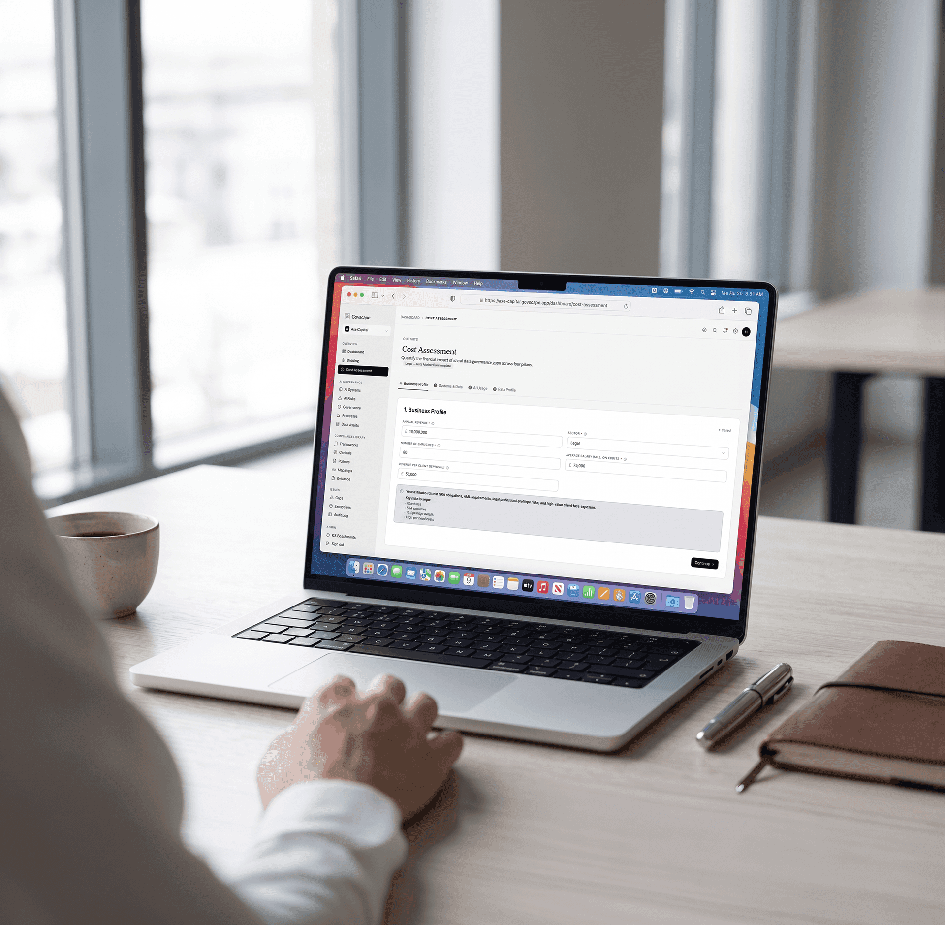 A consultant filling in a Govscape Cost Assessment on a laptop during discovery